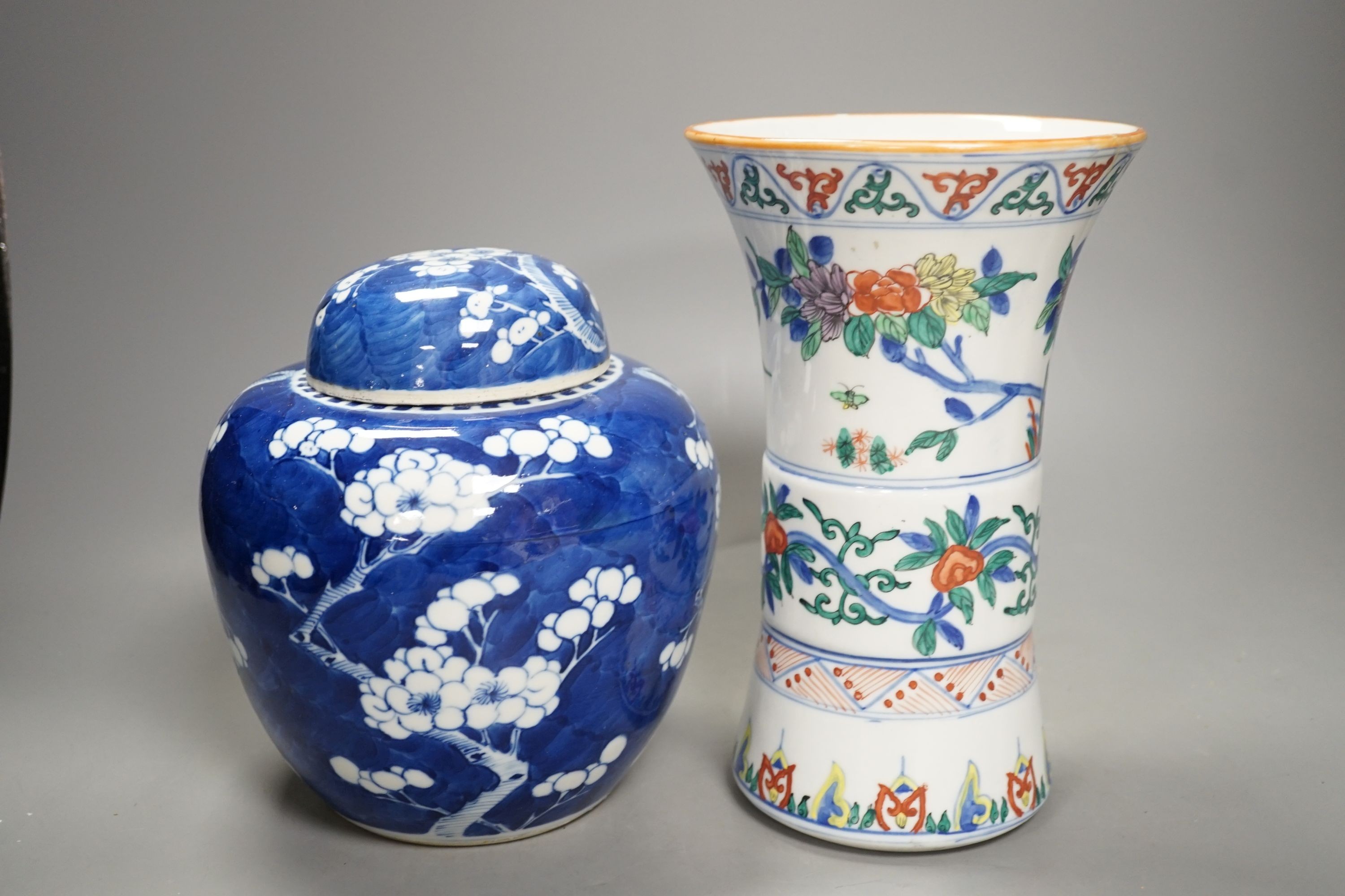 A Chinese prunus jar and cover, a polychrome vase and a famille rose jar, 24cms high.